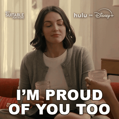 Woman Sitting On Couch With Two Glasses Saying I'm Proud Of You Too GIF
