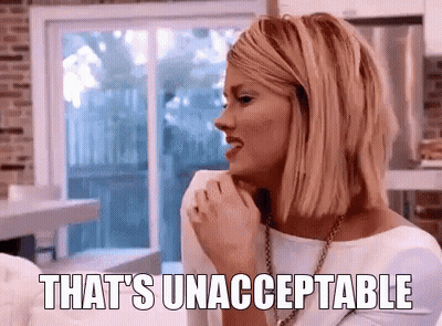 Woman Sitting On Couch With Unacceptable GIF