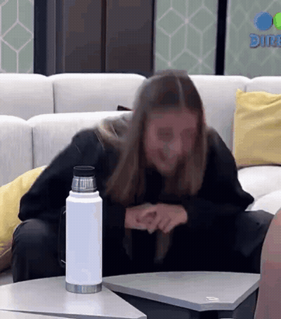 Woman Sitting On Couch With Water Bottle GIF