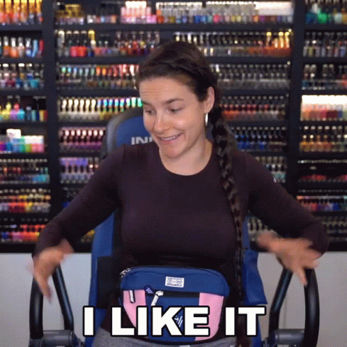 Woman Sitting On Exercise Bike With Bag Saying I Like It GIF