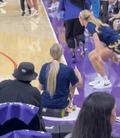 Woman Sitting On Foam Roller Purple Court GIF