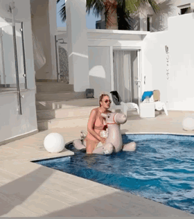 Woman Sitting On Inflatable Hippo GIF
