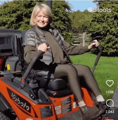 Woman Sitting On Kubota Lawn Mower GIF