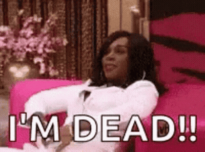 Woman Sitting on Pink Couch Saying Im Dead