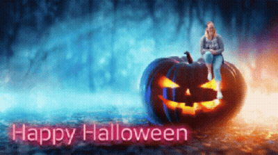 Woman Sitting On Pumpkin Happy Halloween GIF