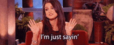 Woman Sitting On Red Couch Saying Im Just Sayin GIF