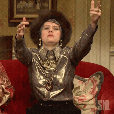 Woman Sitting On Red Couch With SNL GIF