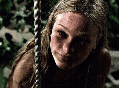 Woman Sitting On Rope Swing Close Up GIF