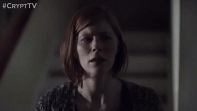 Woman Sitting On Stairs With Eyes Closed GIF