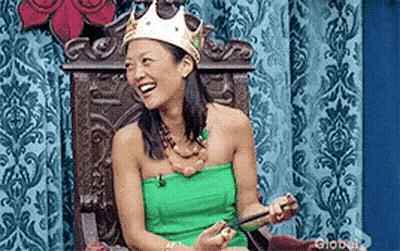 Woman Sitting On Throne In Crown And Green Dress GIF