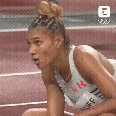 Woman Sitting On Track Looking At Something GIF
