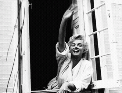 Woman Sitting On Window Sill With Outstretched Arms GIF