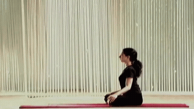 Woman Sitting On Yoga Mat GIF