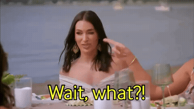 Woman Sitting Says Wait What GIF
