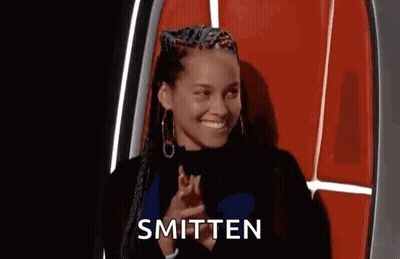 Woman Sitting Smitten GIF