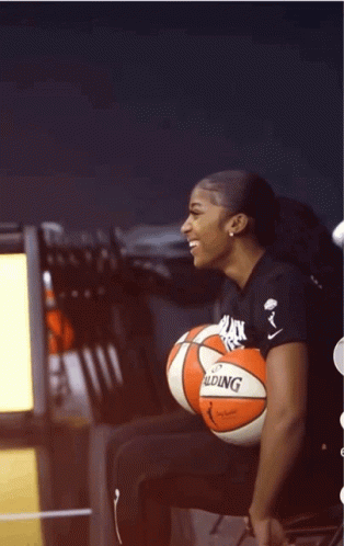 Woman Sitting With Basketball GIF