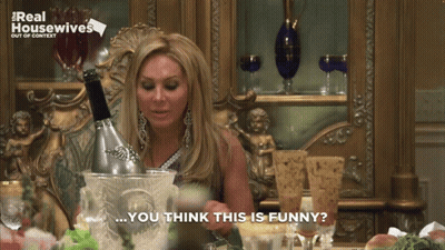 Woman Sitting With Champagne Bucket And Saying You Think This Is Funny GIF
