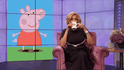 Woman Sitting With Coffee In Front Of Peppa Pig Screen GIF