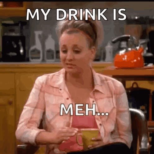 Woman Sitting With Coffee Saying My Drink Is Meh GIF