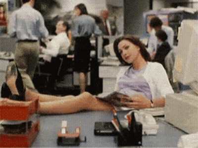 Woman Sitting With Feet On Desk GIF