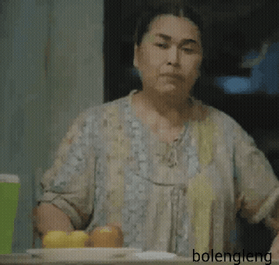 Woman Sitting With Hand On Forehead GIF