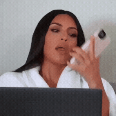 Woman Sitting With Laptop And Cell Phone GIF