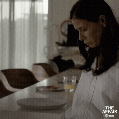Woman Sitting With Orange Juice And Food GIF