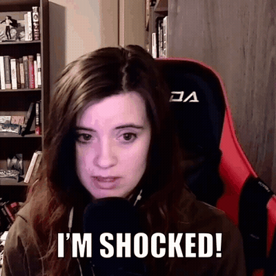 Woman Sitting With Shocked Expression GIF