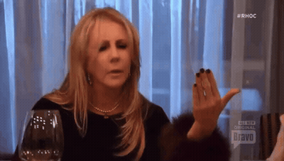 Woman Sitting With Wine And Bravo Sign GIF