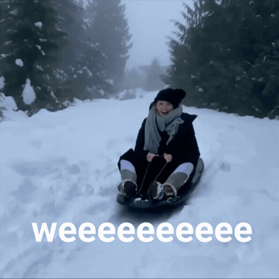 Woman Sledding Down Snowy Hill Weee GIF