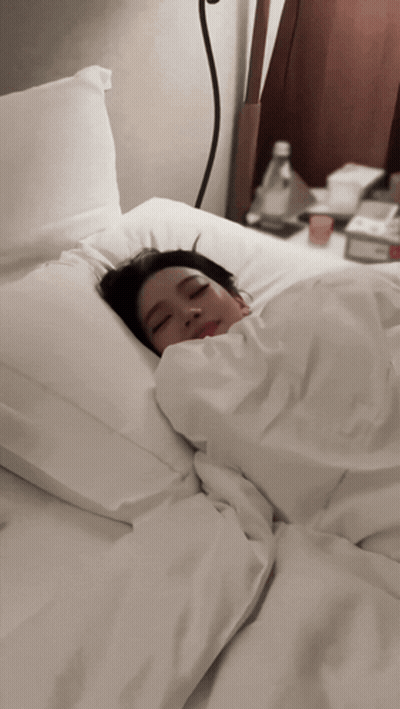 Woman Sleeping In Bed With White Sheets GIF