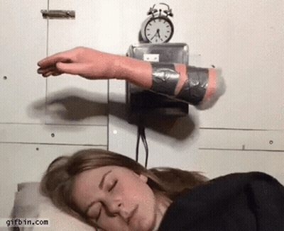 Woman Sleeping Near Alarm Clock GIF