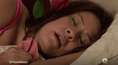 Woman Sleeping On Bed With Hashtag Youngrock GIF