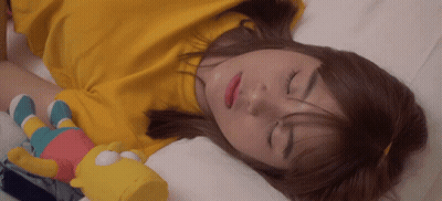 Woman Sleeping With Stuffed Bart Simpson GIF