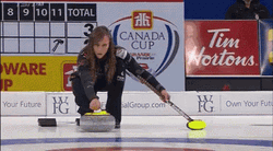 Woman Sliding With Curling Stone GIF