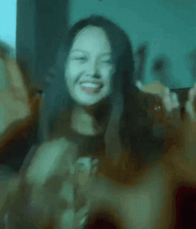 Woman Smiling And Making Peace Sign GIF