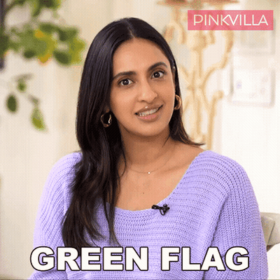 Woman Smiling And Saying Green Flag GIF
