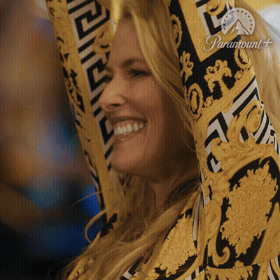 Woman Smiling Arms In Air With Paramount Logo GIF