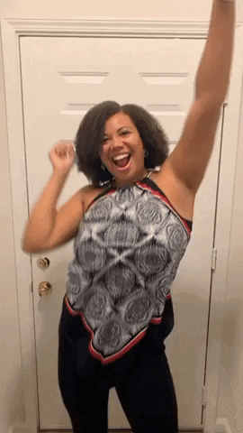 Woman Smiling Arms Up Near Door GIF