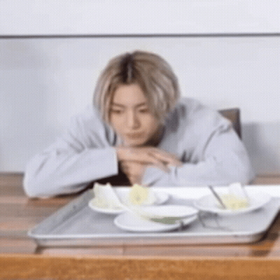 Woman Smiling At Camera Man In Kitchen GIF