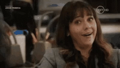 Woman Smiling At Desk GIF