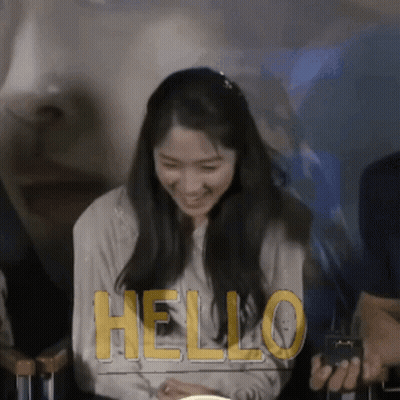Woman Smiling At Hello Sign GIF