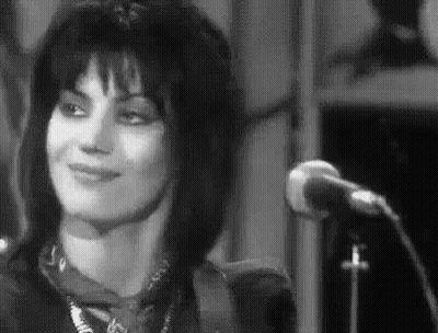 Woman Smiling At Microphone GIF