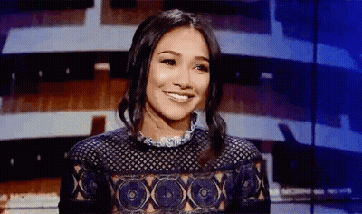 Woman Smiling At Microphone On Stage GIF