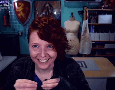 Woman Smiling At Shield Saying UB X79 GIF