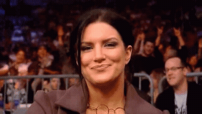 Woman Smiling At Wrestling Event GIF