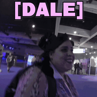 Woman Smiling Beside Sign Saying Dale GIF