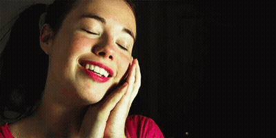 Woman Smiling Eyes Closed Hands On Face GIF