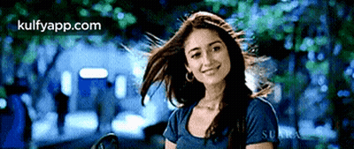 Woman Smiling Hair Blowing In Wind GIF