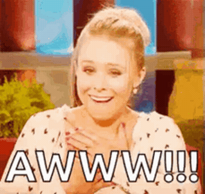 Woman Smiling Hands To Chest Saying Aww GIF